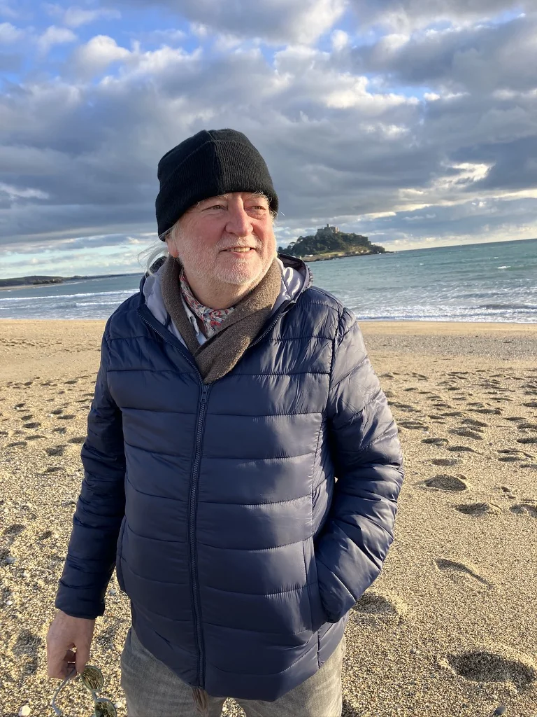 Andie on the beach with St Michael’s Mount behind him